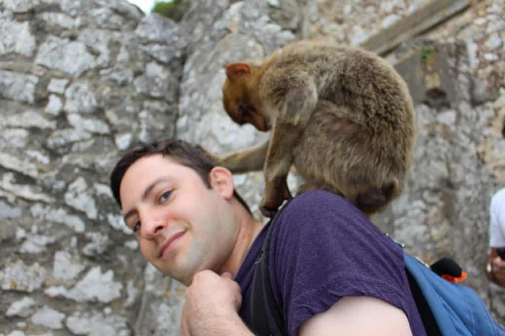 Eric with Monkey at Gibraltar - PersonalProfitability.com