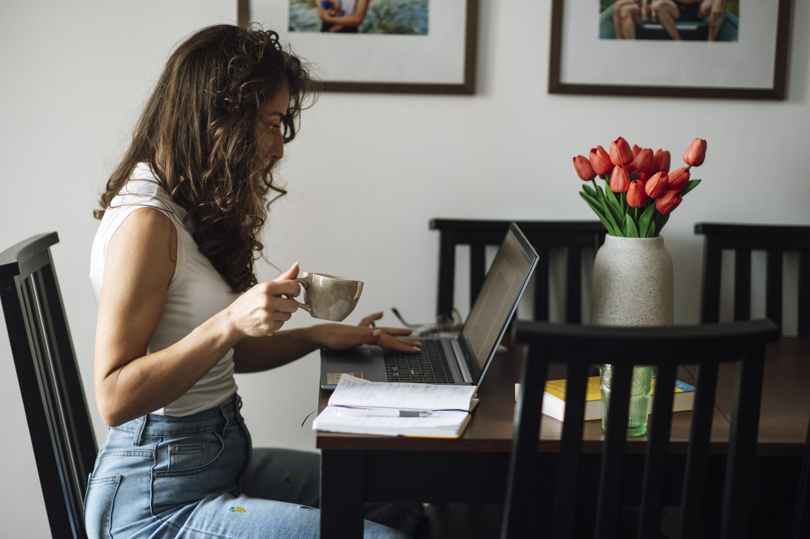 A home office setup for how to start a blog to make money, laptop open with coffee nearby